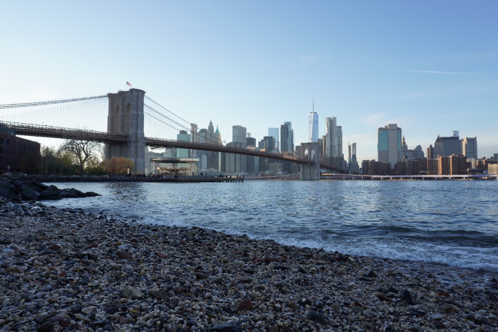 Brooklyn Bridge and Manhattan skyline from the shore